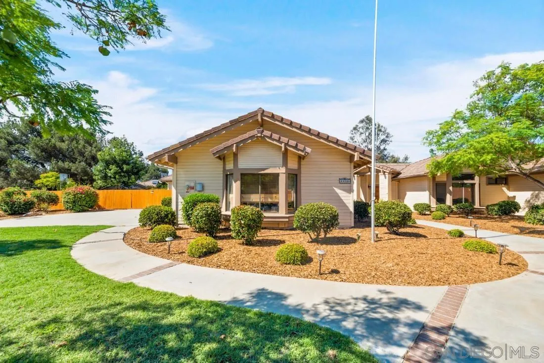 15735 Riparian Road Poway, CA 92064 - Photo 5 of 53 a front view of a house with garden and patio