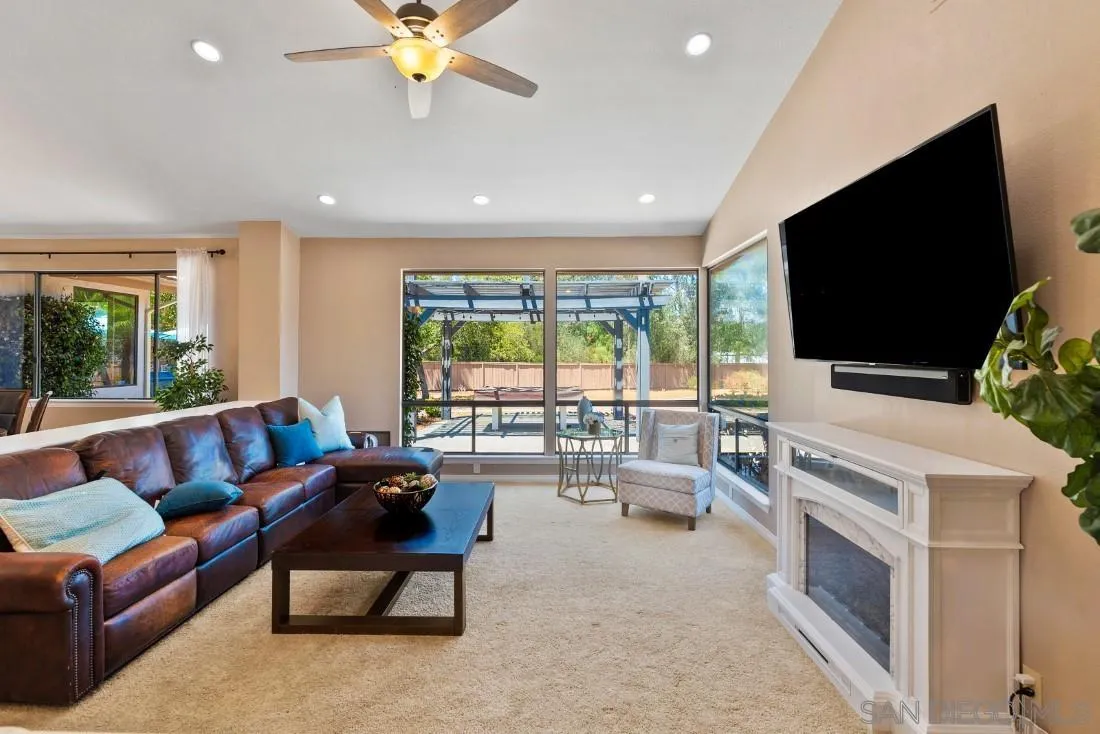 15735 Riparian Road Poway, CA 92064 - Photo 10 of 53 a living room with furniture and a flat screen tv