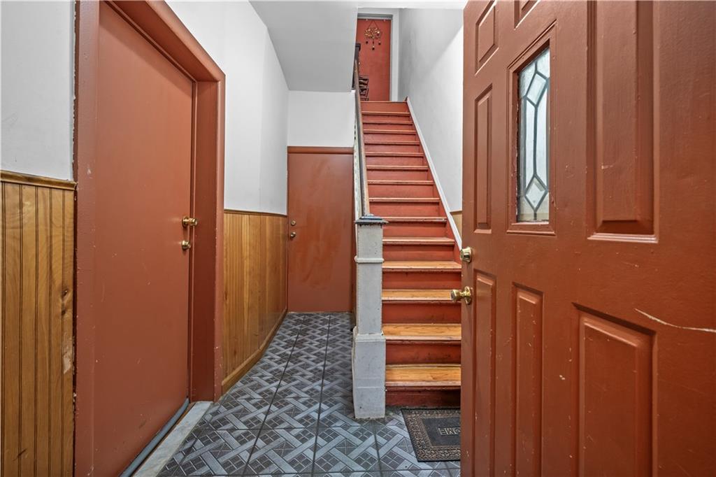 904 Avenue C Brooklyn, NY 11218 - Photo 3 of 13 a view of a hallway with wooden floor and entryway