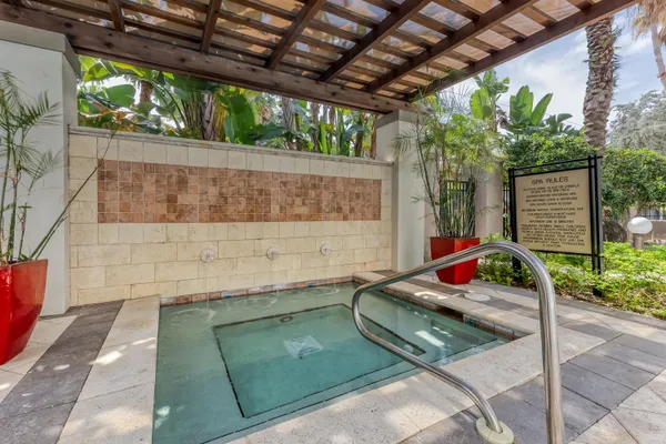 a bedroom with furniture and a flat screen tv