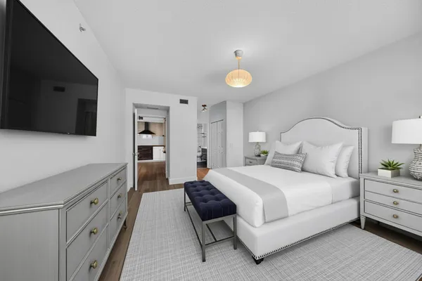 a view of empty room with wooden floor and window