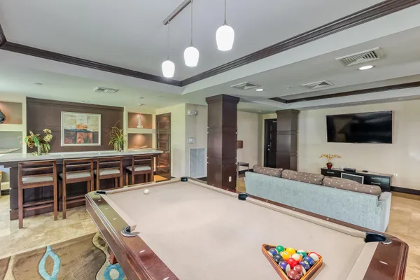 a living room with furniture and large window