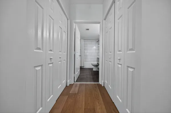 a view of a livingroom with wooden floor