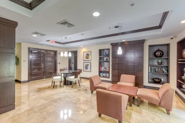 a workspace with kitchen island granite countertop furniture and a fireplace