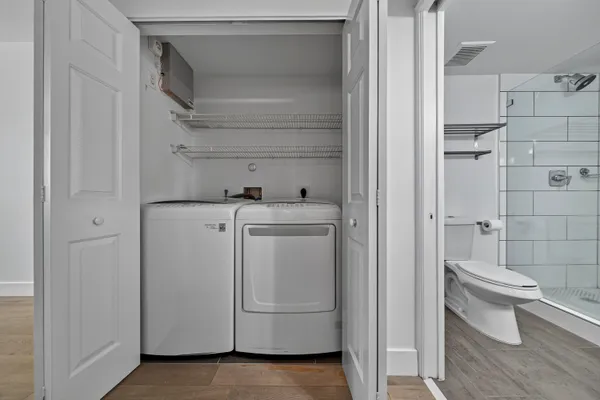 a kitchen with a refrigerator an oven