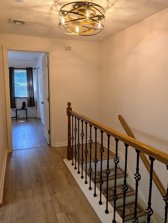 24 Charles Street, Unit 10 Douglas, MA 01516 - Photo 13 of 35 a view of a hallway with wooden floor