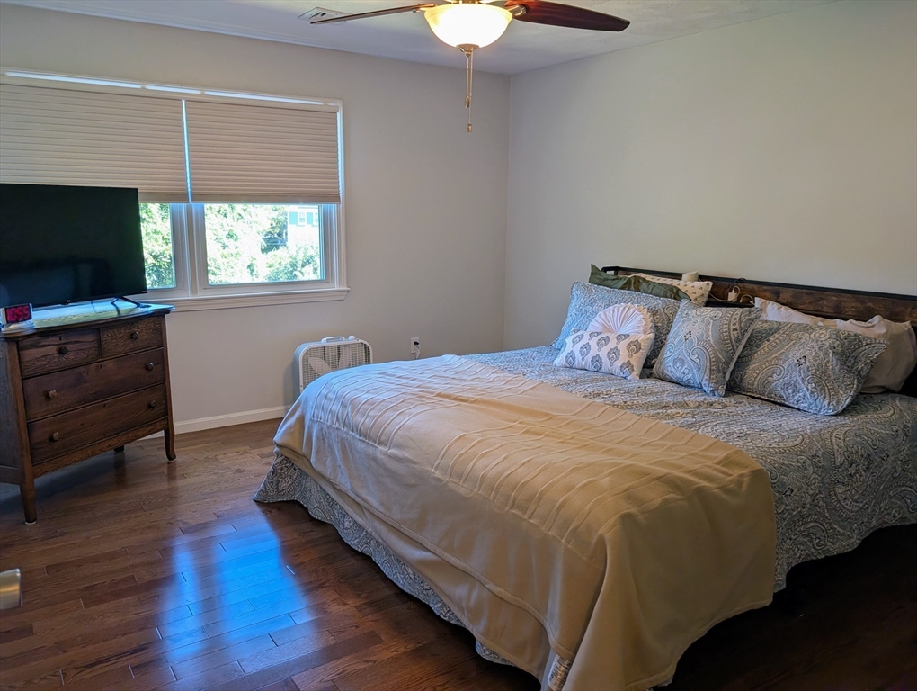 24 Charles Street, Unit 10 Douglas, MA 01516 - Photo 14 of 35 a bedroom with a bed and a flat screen tv