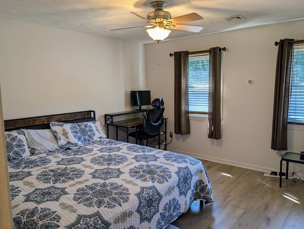 24 Charles Street, Unit 10 Douglas, MA 01516 - Photo 15 of 35 a bed sitting in a bedroom next to a window