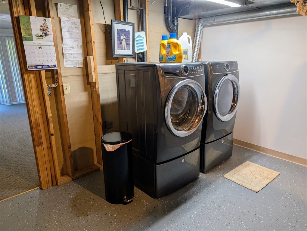 24 Charles Street, Unit 10 Douglas, MA 01516 - Photo 26 of 35 a utility room with dryer and washer