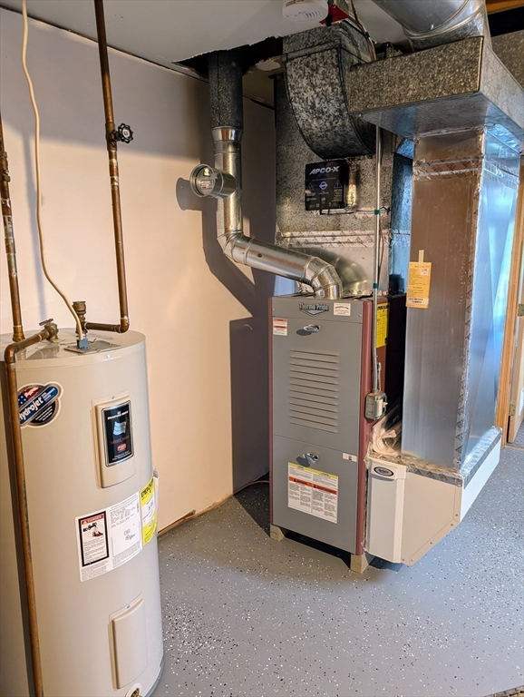 24 Charles Street, Unit 10 Douglas, MA 01516 - Photo 27 of 35 a view of a storage and utility room with washer and dryer