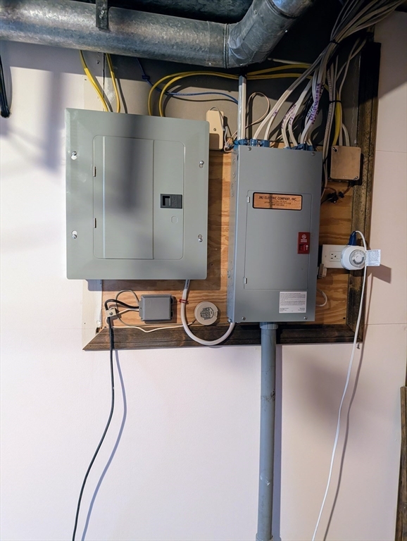 24 Charles Street, Unit 10 Douglas, MA 01516 - Photo 28 of 35 a water heater on the wall