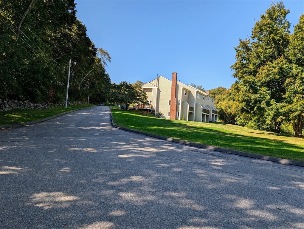 24 Charles Street, Unit 10 Douglas, MA 01516 - Photo 35 of 35 a view of street with large trees