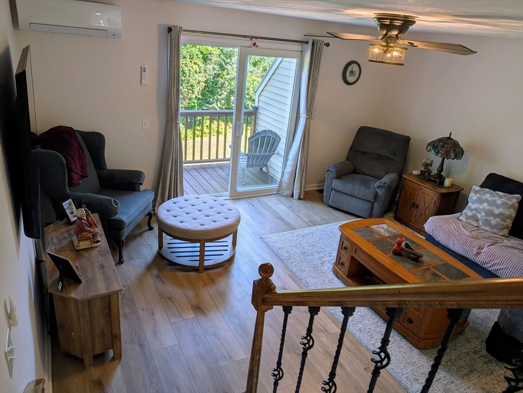 24 Charles Street, Unit 10 Douglas, MA 01516 - Photo 9 of 35 a living room with furniture and a window
