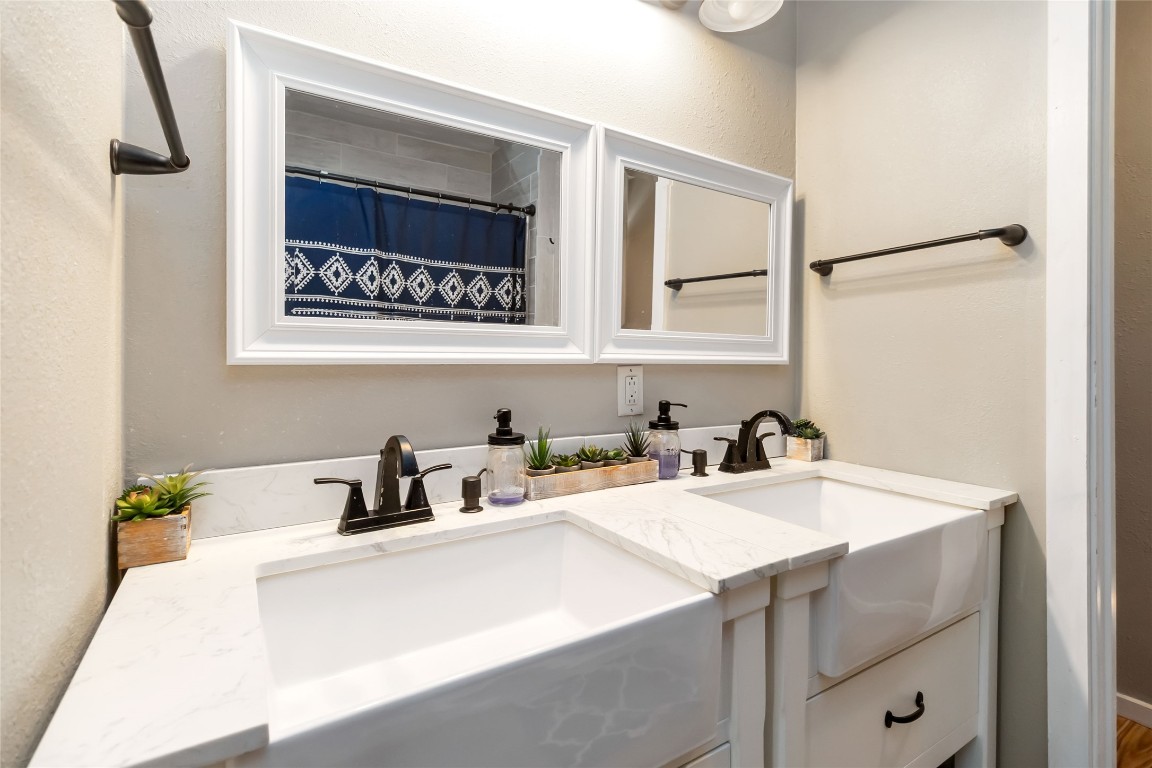 227 Henderson Lane Lockhart, TX 78644 - Photo 13 of 38 a bathroom with a sink and a washing machine
