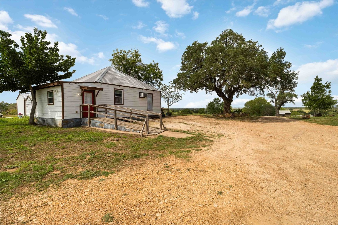 227 Henderson Lane Lockhart, TX 78644 - Photo 21 of 38 a view of a house with a yard