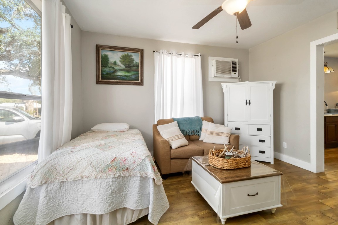 227 Henderson Lane Lockhart, TX 78644 - Photo 23 of 38 a bed room with furniture and wooden floor