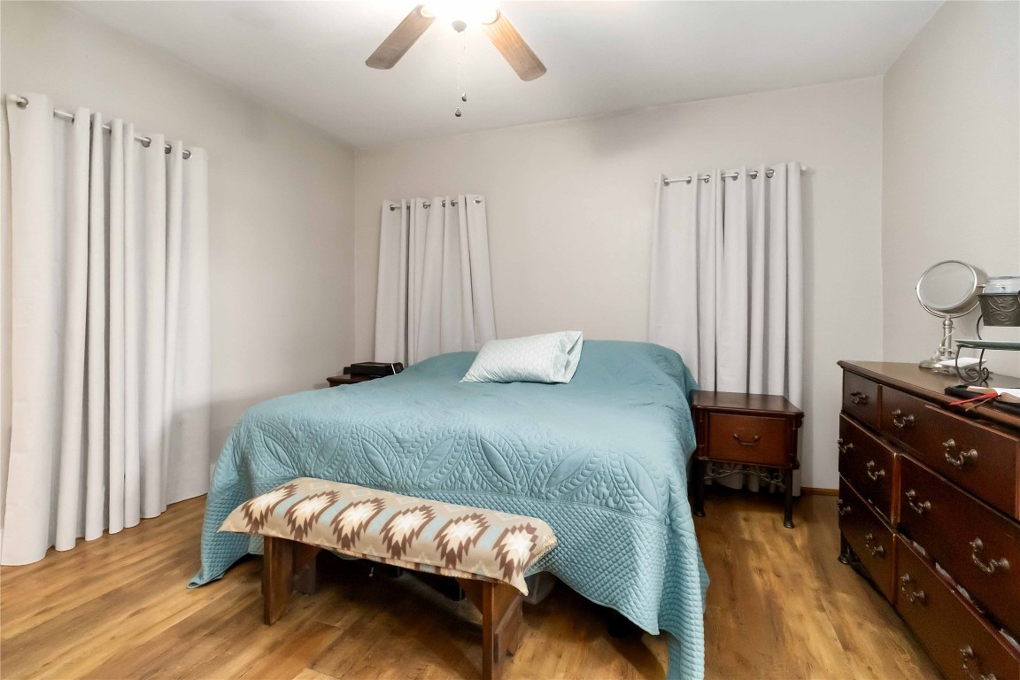 227 Henderson Lane Lockhart, TX 78644 - Photo 28 of 38 a bedroom with a bed and a dresser