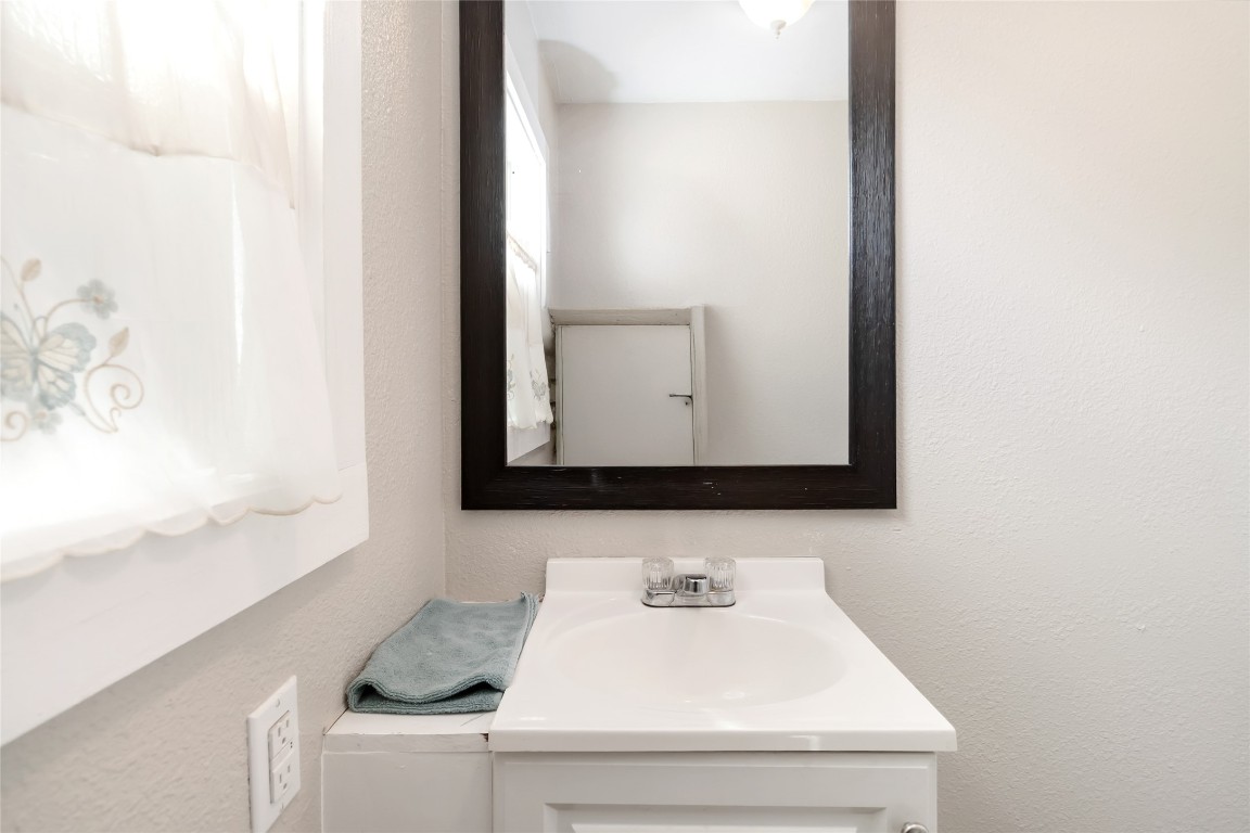 227 Henderson Lane Lockhart, TX 78644 - Photo 31 of 38 a bathroom with a sink and a mirror