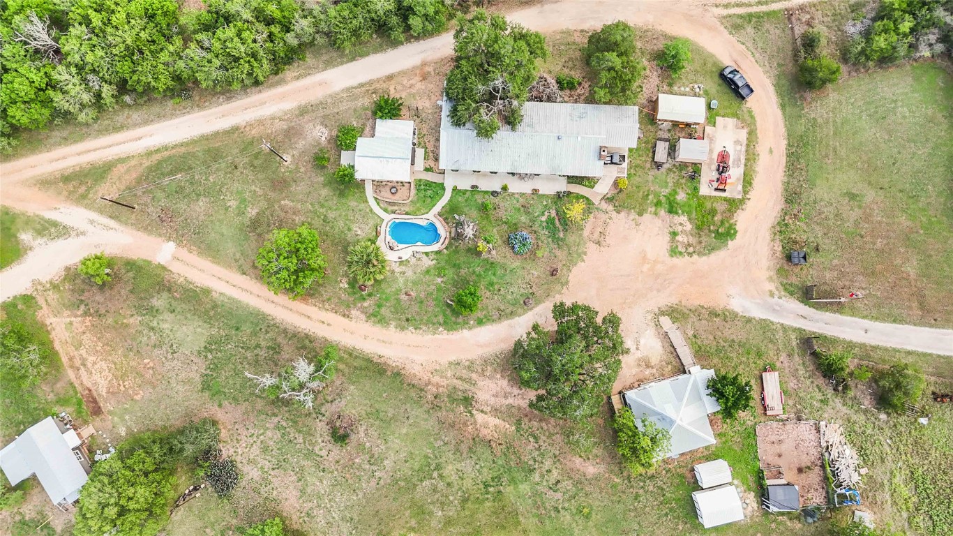 227 Henderson Lane Lockhart, TX 78644 - Photo 34 of 38 a view of a small pool with a yard