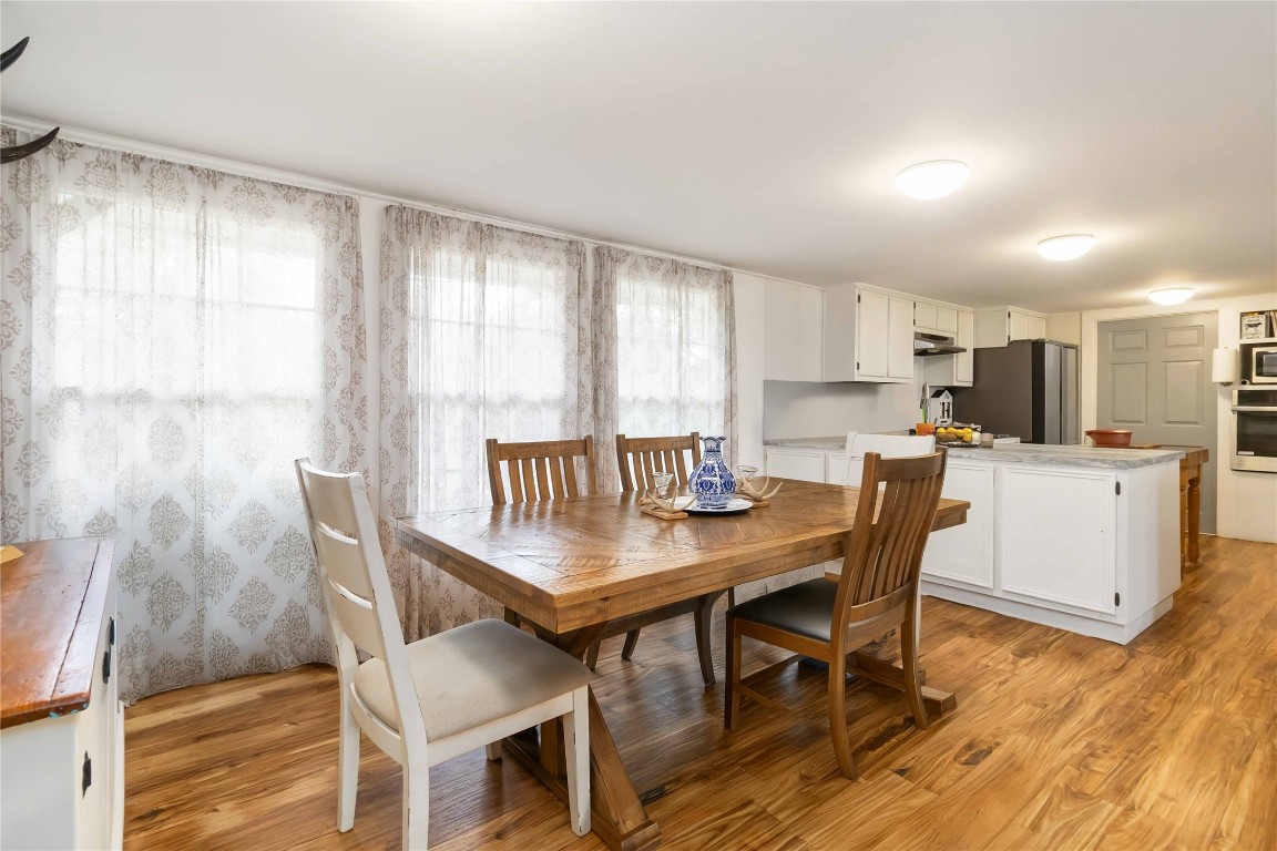 227 Henderson Lane Lockhart, TX 78644 - Photo 8 of 38 a view of a dining room with furniture and wooden floor