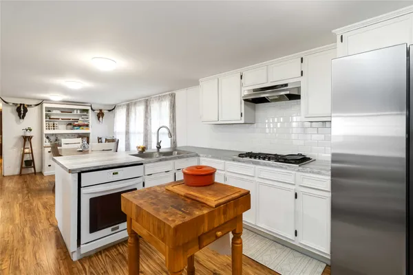 a bathroom with a sink vanity and a mirror