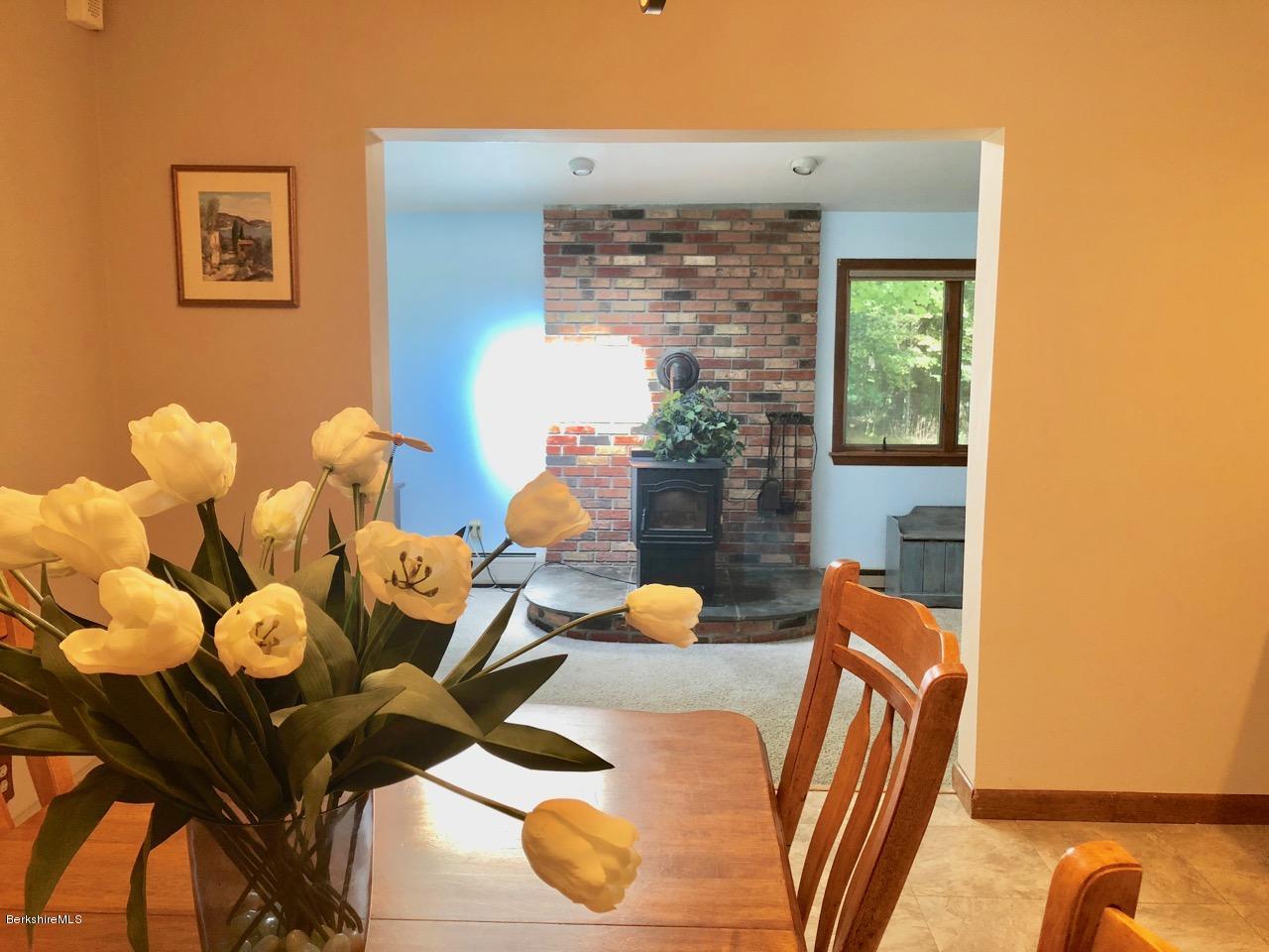 83 Pine Knoll Road Lenox, MA 01240 - Photo 13 of 32 a view of a dining room with furniture and wooden floor
