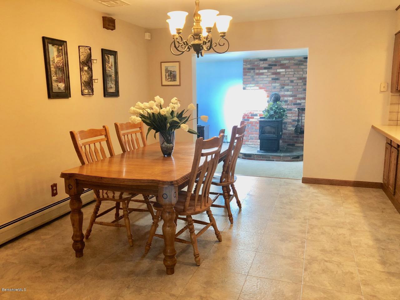 83 Pine Knoll Road Lenox, MA 01240 - Photo 14 of 32 a view of a dining room with furniture and wooden floor