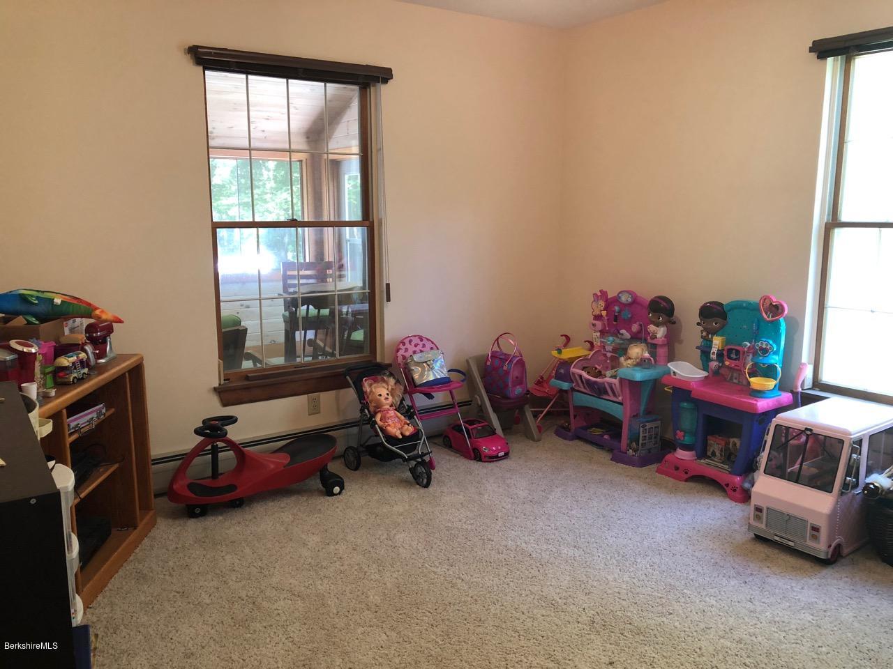 83 Pine Knoll Road Lenox, MA 01240 - Photo 16 of 32 a room with toys and a window