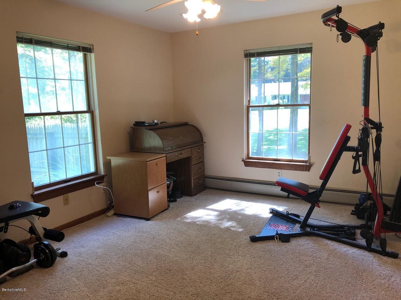 83 Pine Knoll Road Lenox, MA 01240 - Photo 17 of 32 a view of a room with gym equipment