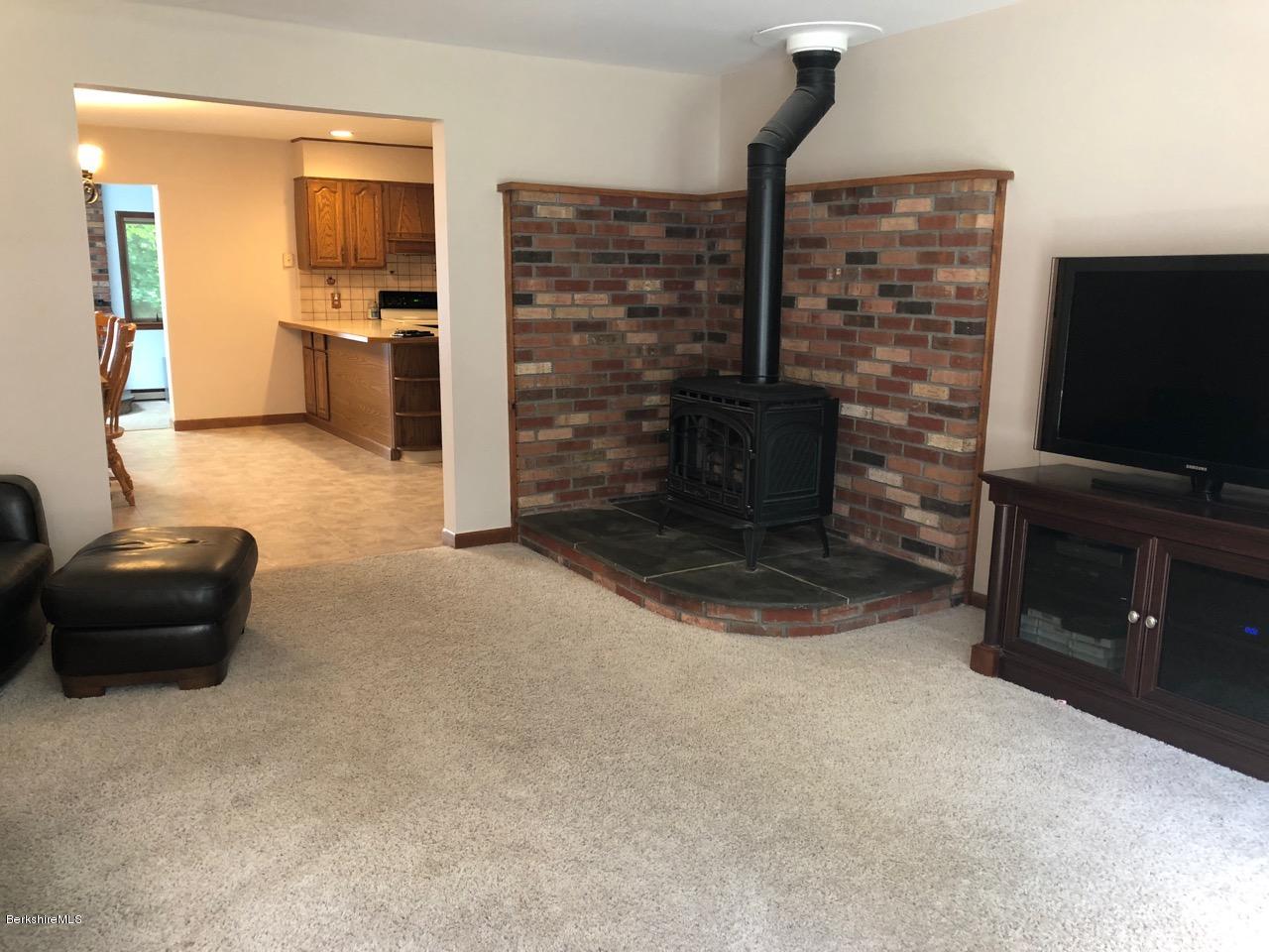 83 Pine Knoll Road Lenox, MA 01240 - Photo 19 of 32 a living room with furniture and a flat screen tv