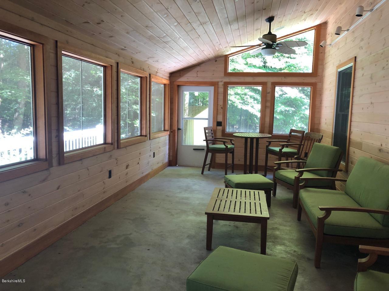 83 Pine Knoll Road Lenox, MA 01240 - Photo 23 of 32 a living room with furniture and a window