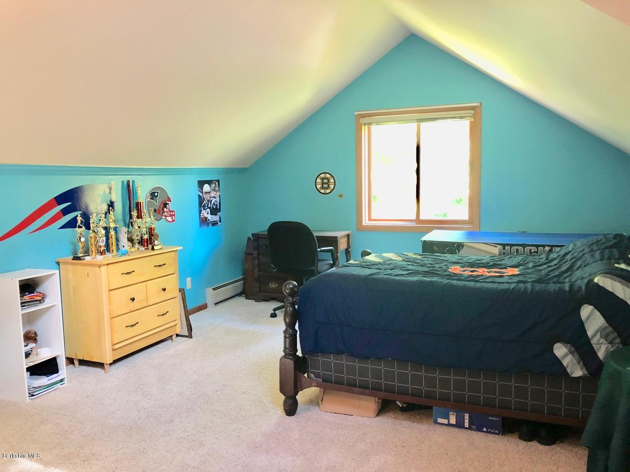 83 Pine Knoll Road Lenox, MA 01240 - Photo 26 of 32 a bedroom with a bed and a closet
