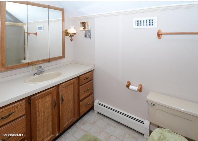 83 Pine Knoll Road Lenox, MA 01240 - Photo 29 of 32 a bathroom with a sink and a mirror