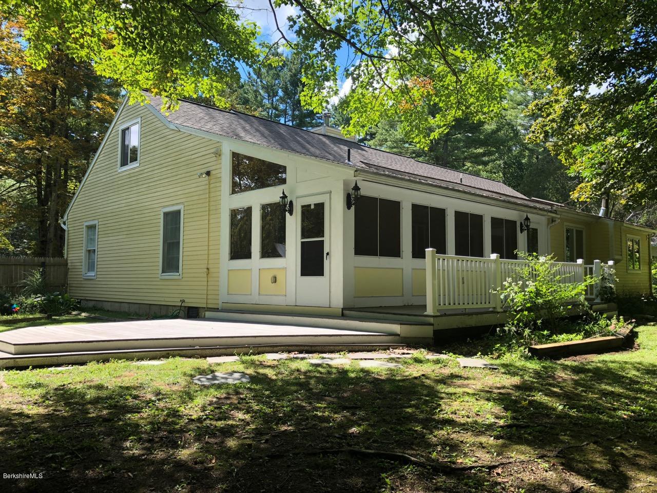 83 Pine Knoll Road Lenox, MA 01240 - Photo 5 of 32 a house with trees in front of it