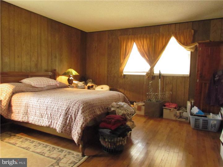 2122 Colony Road Jamison, PA 18929 - Photo 11 of 14 a bedroom with a bed and wooden floor