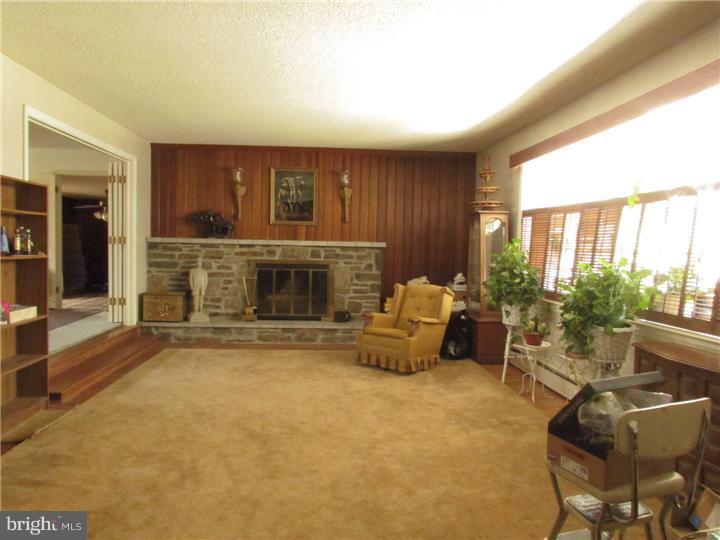 2122 Colony Road Jamison, PA 18929 - Photo 4 of 14 a living room with furniture and a fireplace