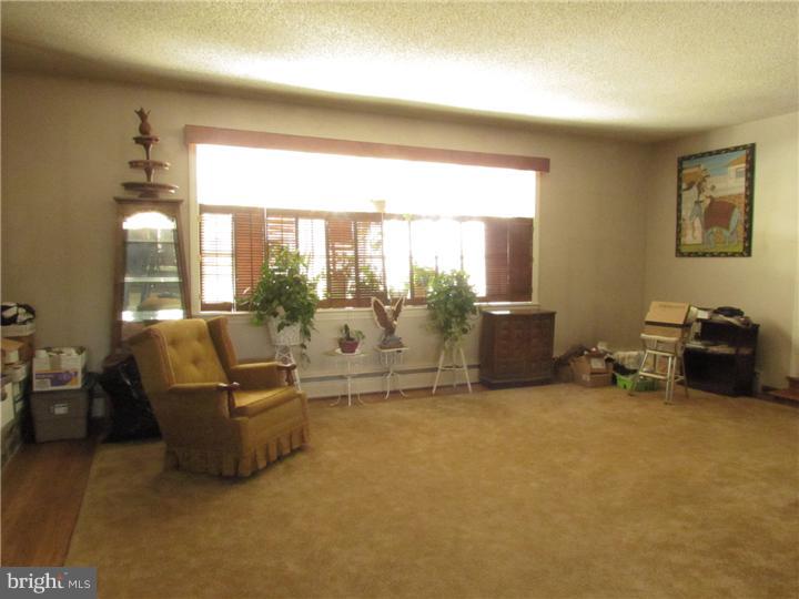 2122 Colony Road Jamison, PA 18929 - Photo 5 of 14 a living room with furniture and a floor to ceiling window