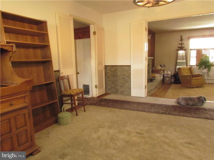 2122 Colony Road Jamison, PA 18929 - Photo 8 of 14 a living room with furniture a dining table and a large window