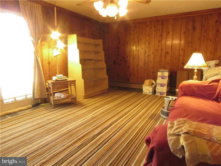 2122 Colony Road Jamison, PA 18929 - Photo 10 of 14 a view of a bedroom with wooden floor and chair