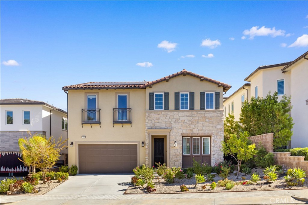12000 Mirabel Way Porter Ranch, CA 91326 - Photo 1 of 59 a front view of a house with garden