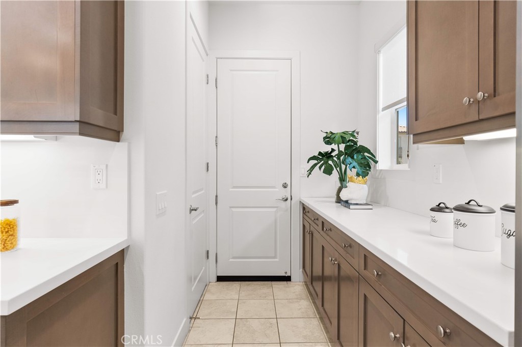 12000 Mirabel Way Porter Ranch, CA 91326 - Photo 12 of 59 a kitchen with a sink and cabinets