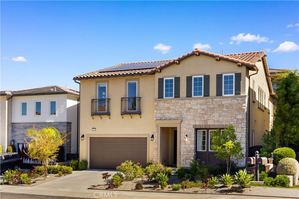 12000 Mirabel Way Porter Ranch, CA 91326 - Photo 2 of 59 a front view of a house with a yard