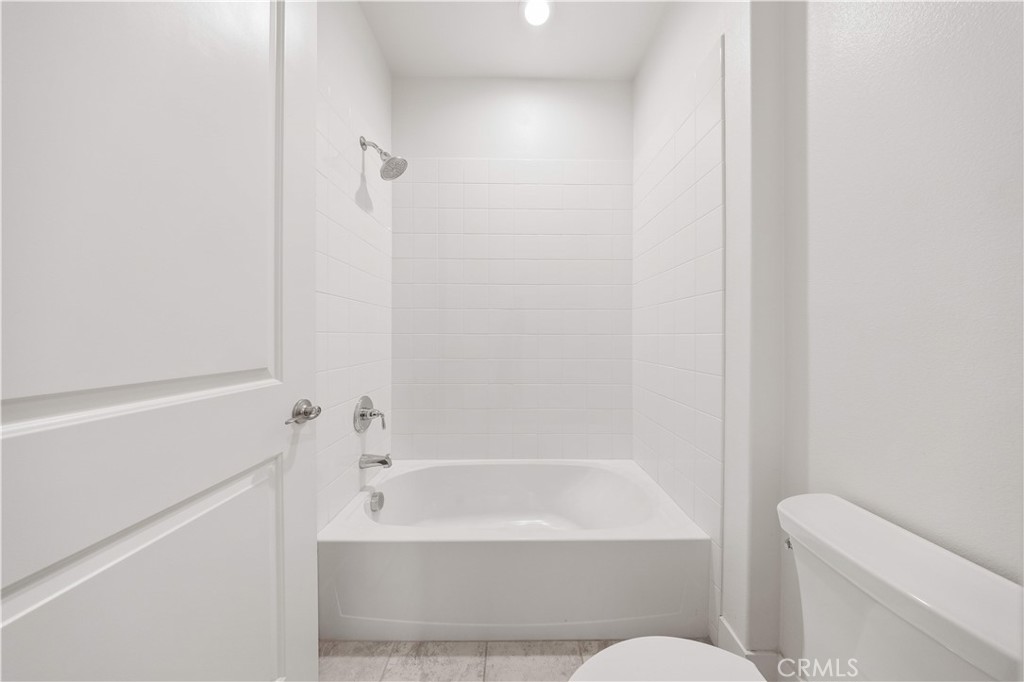 12000 Mirabel Way Porter Ranch, CA 91326 - Photo 40 of 59 a bathroom with a bathtub and a toilet