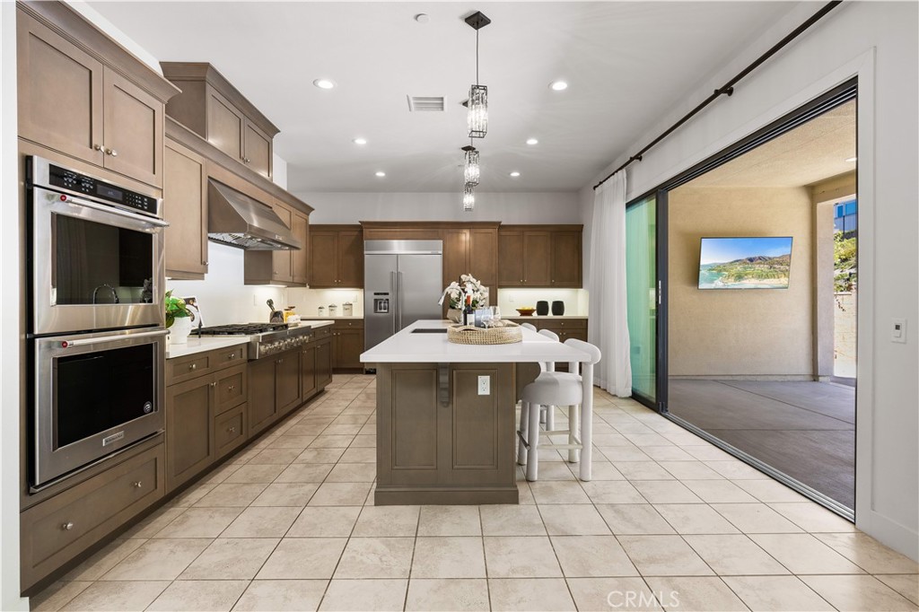 12000 Mirabel Way Porter Ranch, CA 91326 - Photo 8 of 59 a kitchen with a sink cabinets and window