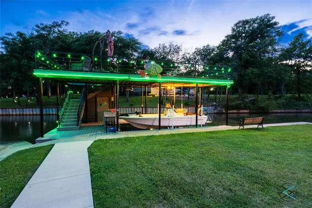 a view of a park with furniture and garden