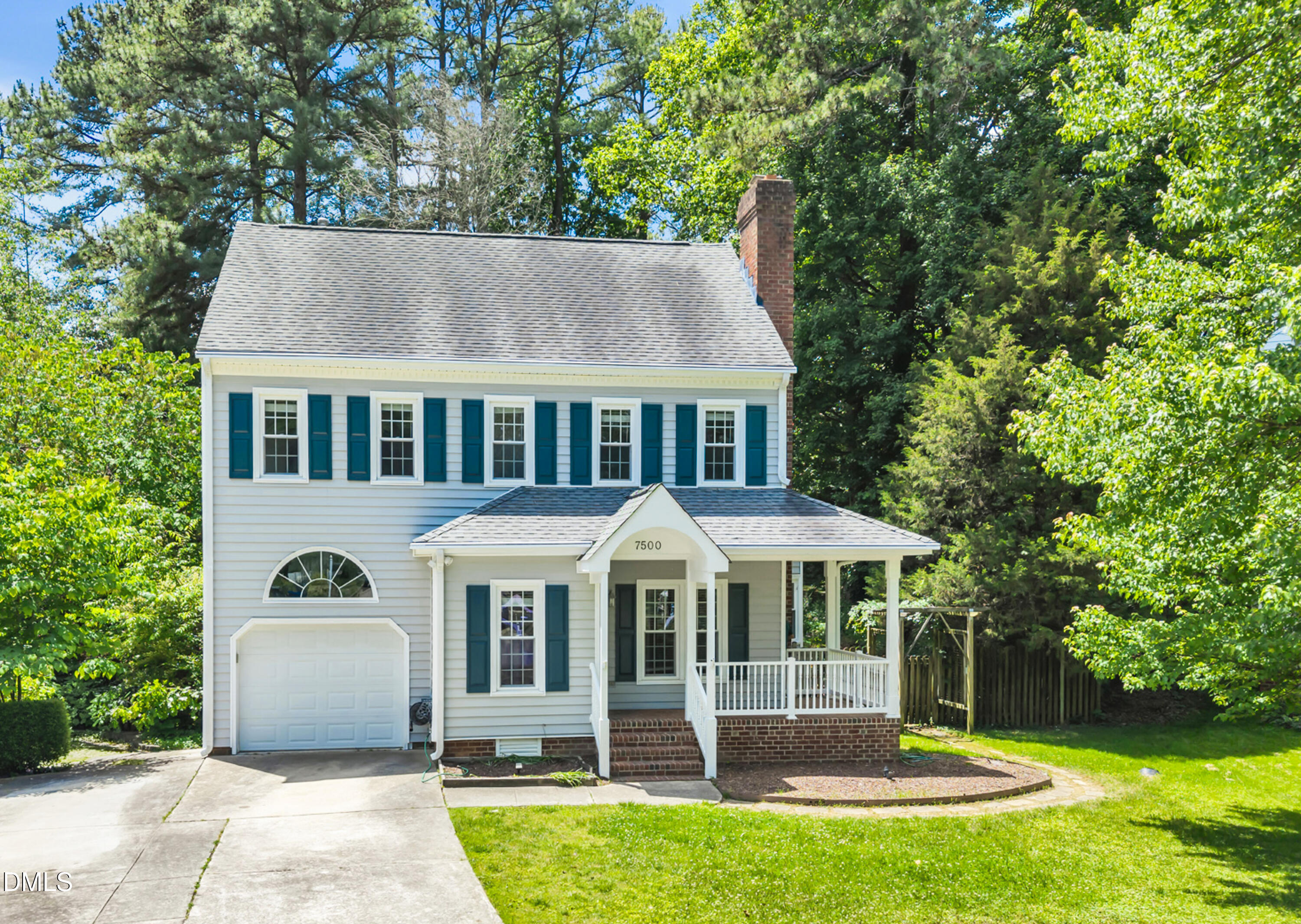 7500 Drayton Court Raleigh, NC 27615 - Photo 1 of 27 a front view of a house with a yard