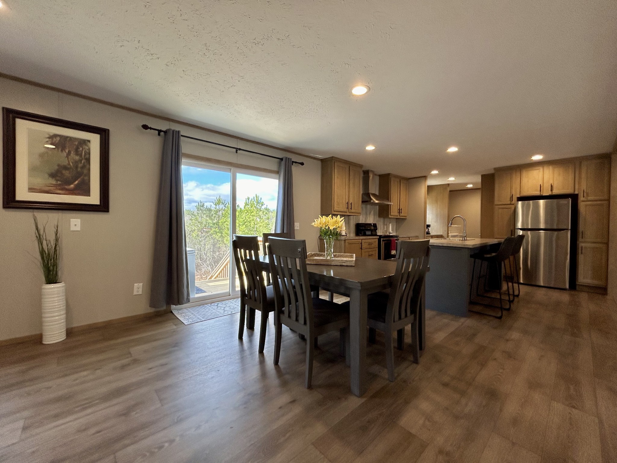 443 Sickler Road Hohenwald, TN 38462 - Photo 12 of 33 a view of a dining room with furniture window and wooden floor