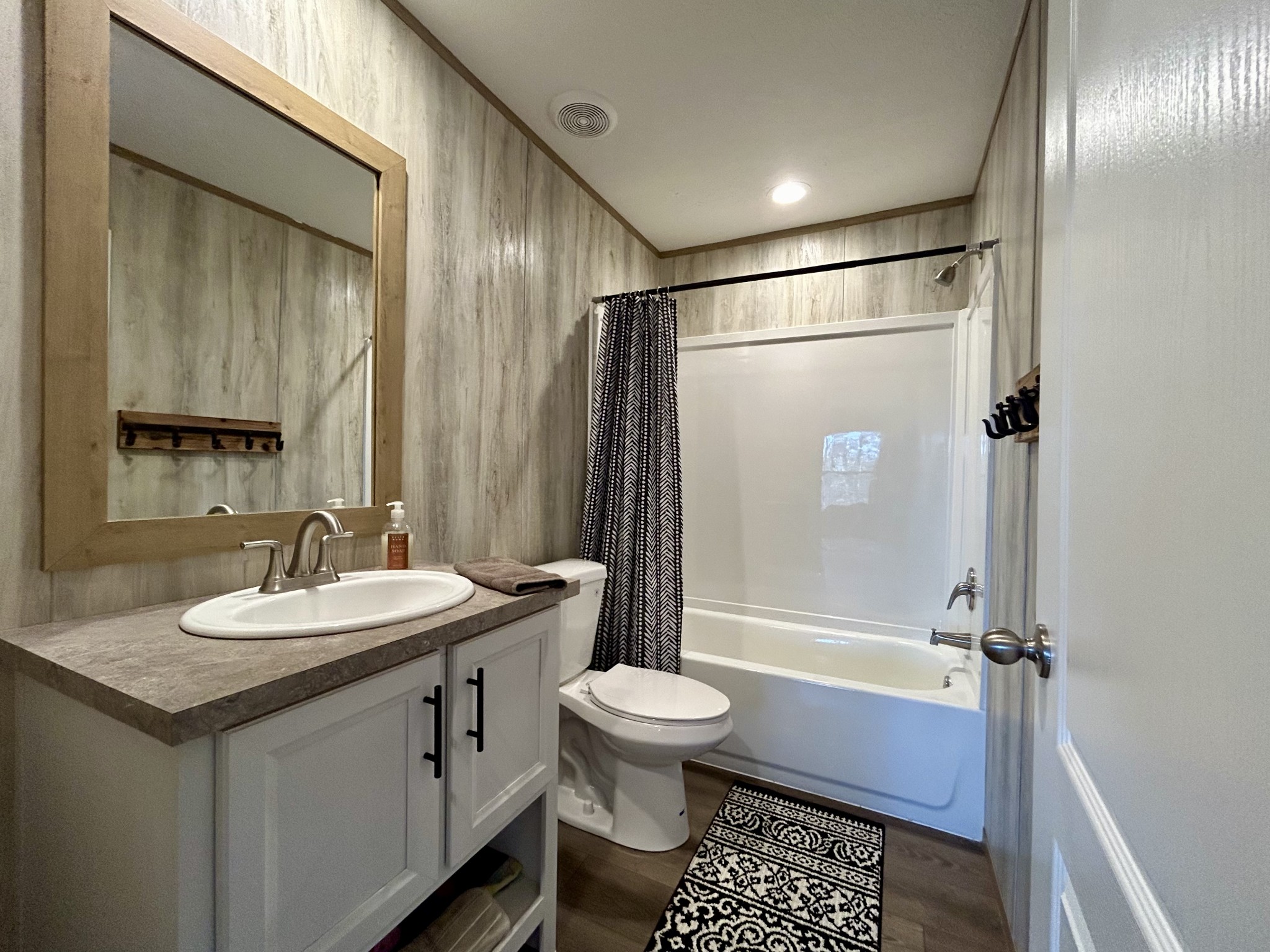 443 Sickler Road Hohenwald, TN 38462 - Photo 16 of 33 a bathroom with a sink a toilet and shower