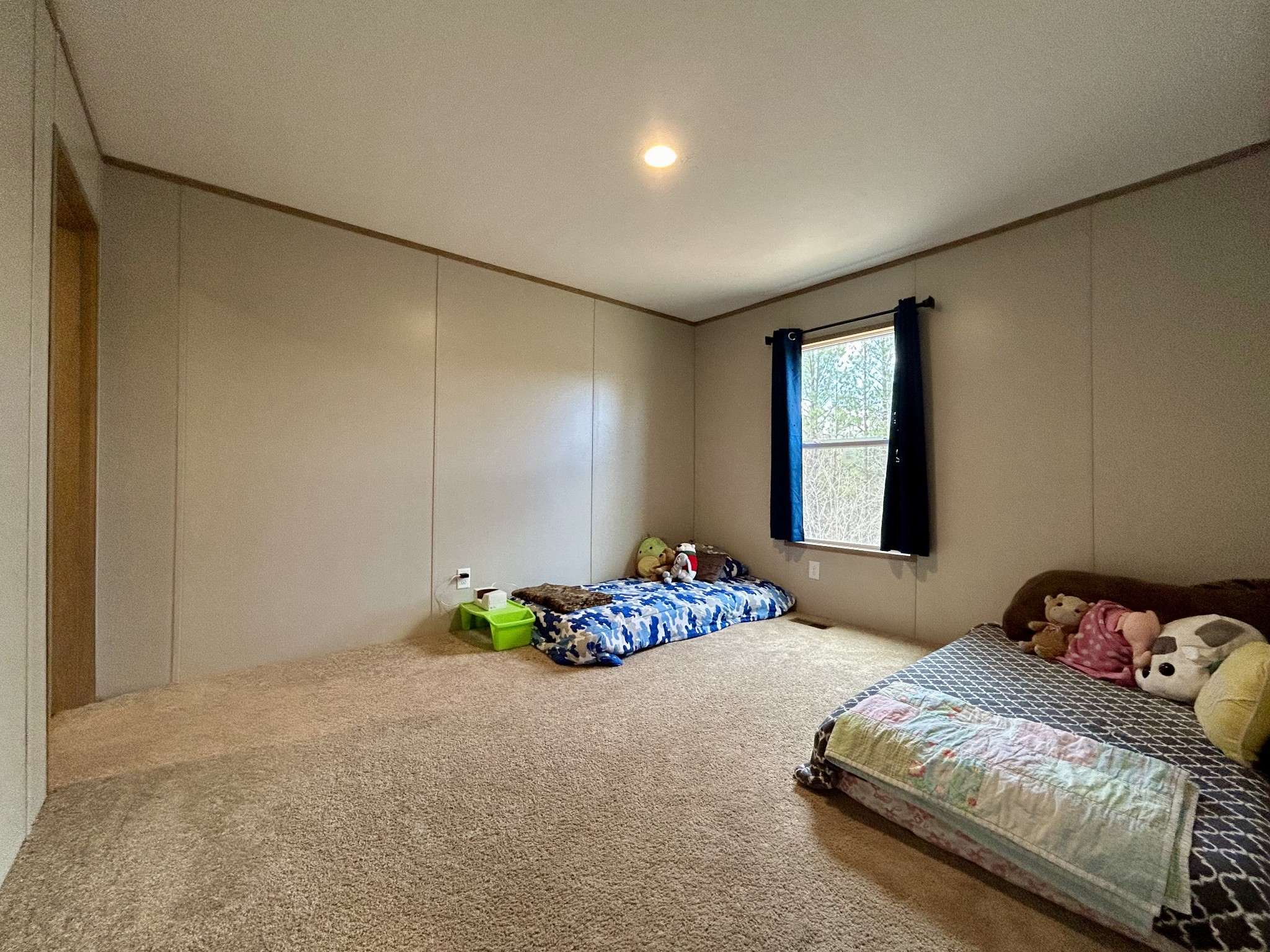 443 Sickler Road Hohenwald, TN 38462 - Photo 17 of 33 a bedroom with a bed and a window