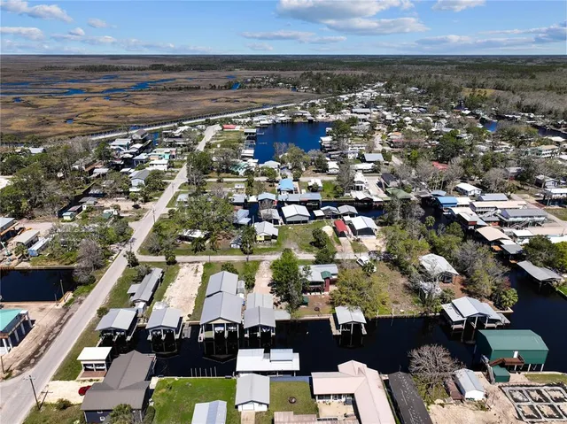 an aerial view of residential houses with outdoor space